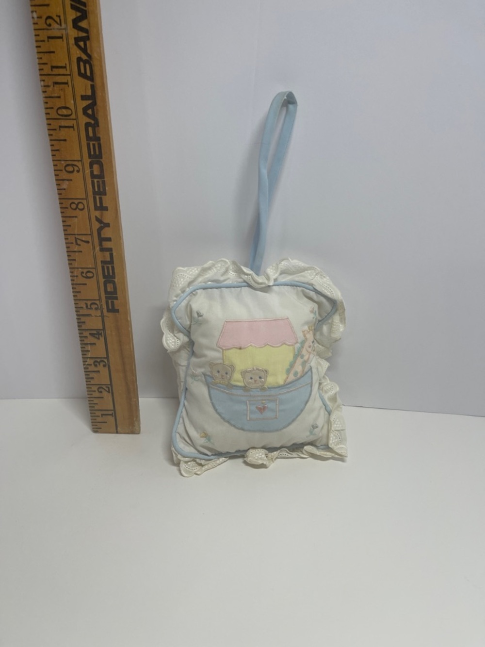 vintage decorative pillow from House of Hatten Inc. wind up